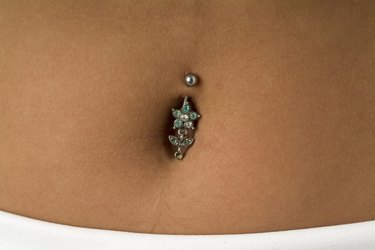 Close-up of a piercing in the navel