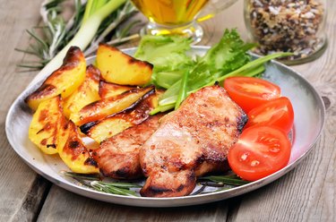 Grilled pork cutlets with baked potatoes