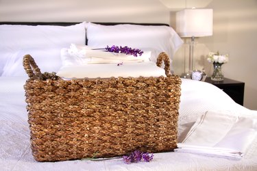 Linen basket with white sheets