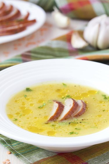 Cream soup of red lentil with smoked meat, duck, chicken