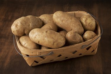 Basket of Russet Potatoes on a Table