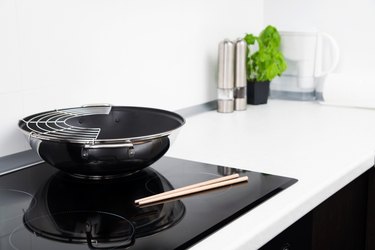 Frying pan and sticks in modern kitchen