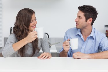 Couple drinking cups of coffee
