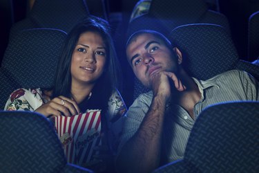 Couple watching movie in cinema