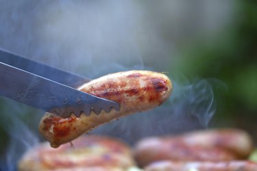 barbecue tongs with sausege