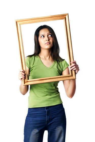 A woman holding a photo frame