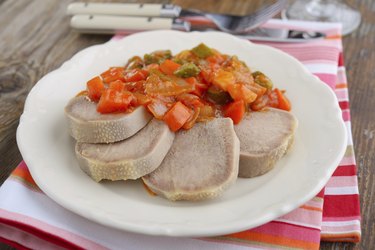 Boiled beef tongue and sauce with gherkins