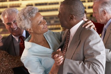 Couples Dancing Together At A Nightclub