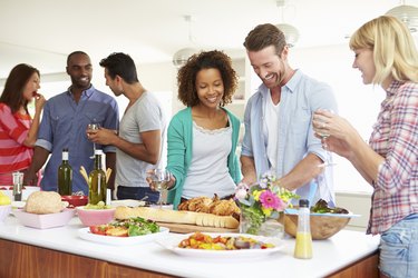 Group Of Friends Having Dinner Party At Home