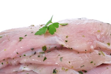 raw chicken meat marinated with parsley and olive oil