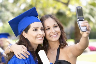 Graduate With a Friend, Taking a Picture of Themselves With a Mobile Phone