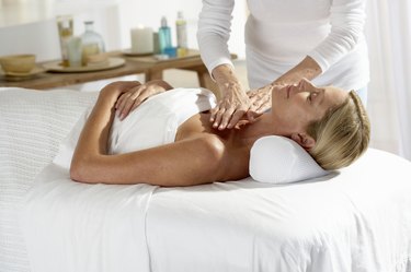 Woman laying on table having a massage