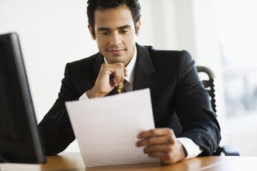 Businessman looking at paper