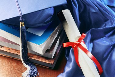 Diploma, tassel and books