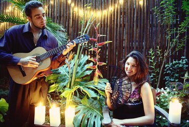 Man playing guitar for woman