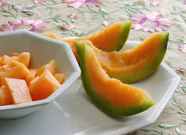 lucious canteloupe or musk melon in a white china dish