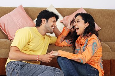 A young couple relaxing indoors