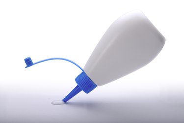 Glue bottle squeeze (clipping path)