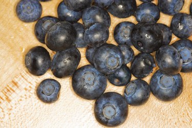 Blueberries on wood cutting-board