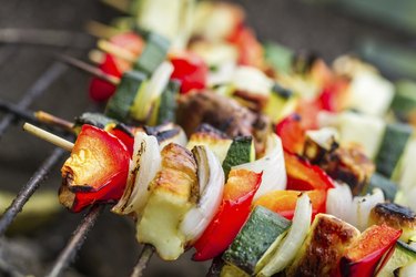 Skewers with chiken and vegetables on the grill