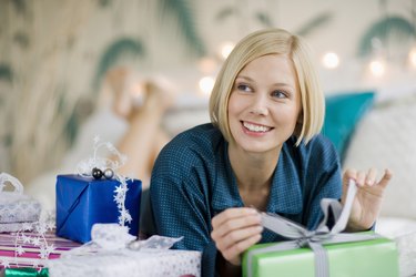 Woman lying with Christmas gifts