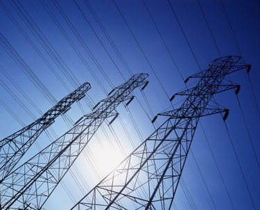 low angle view of high tension cable towers