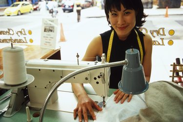 Woman using sewing machine