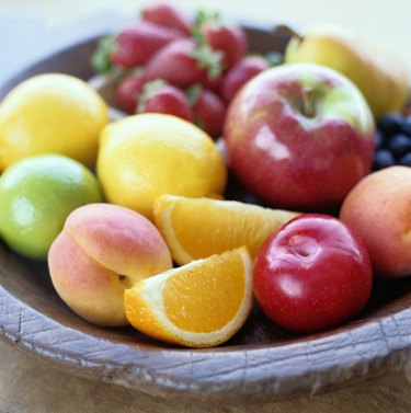 Variety of fruits in a wooden bowl