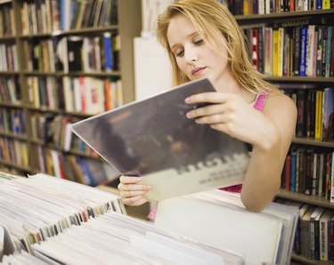 Woman shopping for albums in record store