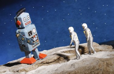 Astronaut figurines and giant robot toy