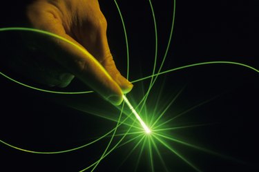 Fibre optics with laser; strand of optical glass , close-up