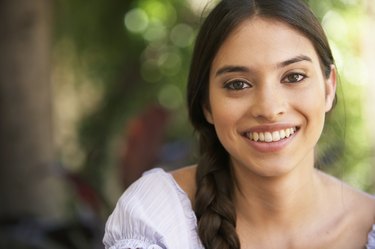 Young woman smiling, portrait, close-up
