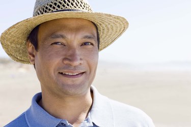 Portrait of man in straw hat