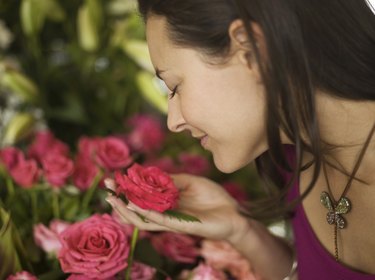 Woman smelling flowers