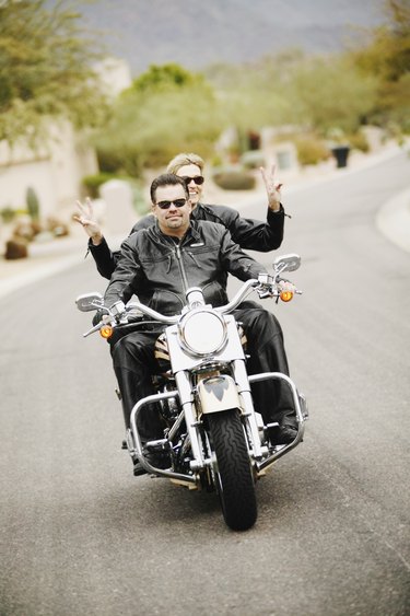 Couple riding motorcycle