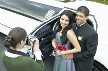 Mother Photographing Couple Departing for Their High School Prom