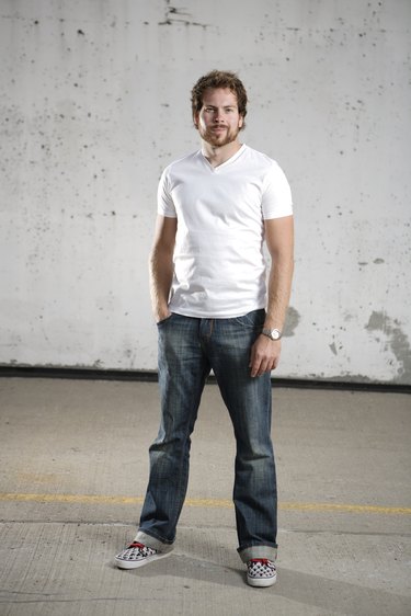 Man posing in bluejeans and t-shirt