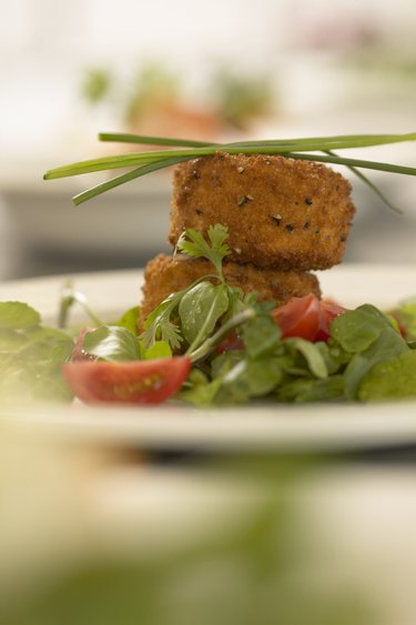 Plate of fish cakes garnished with chives