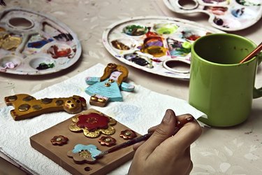 Children painting pottery