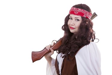 Pirate girl with a musket isolated on white background