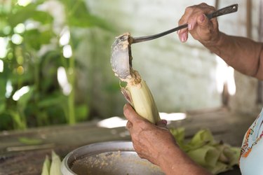 Woman making tamales in Cuba