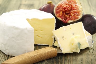Cheese and fresh figs closeup.
