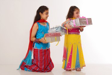 Two girls holding gifts, children