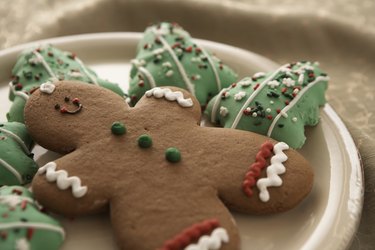 Gingerbread man and Christmas cookies on plate, elevated view