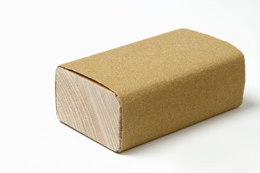 Sanding block wrapped with sanding paper