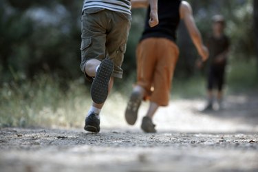 boys running on trail