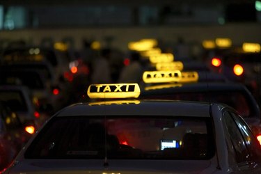 Row of illuminated taxis