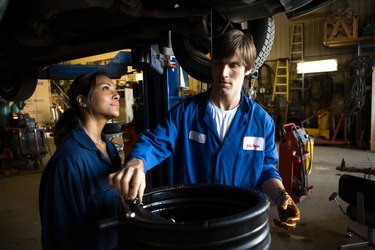 Mechanics doing oil change