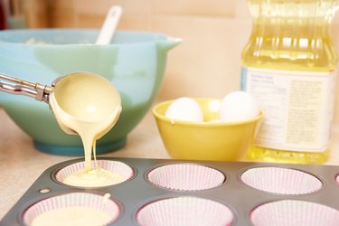 Pouring batter into muffin tin