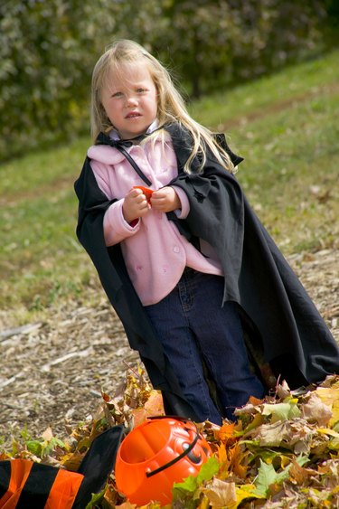 Child in Halloween witch costume